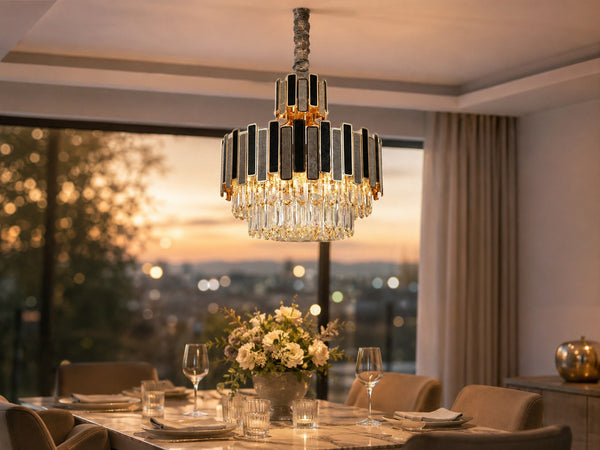 Crystal chandelier above a dining table at dusk